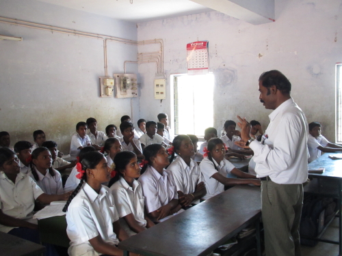 NSS programme officer MR. A. Poorna chandran taking class for the children 