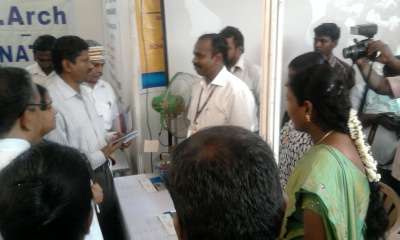 Collector Sagayam with the staff members at the Education Expo